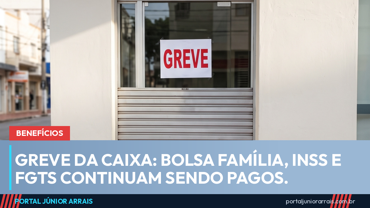 Porta de agência bancária com a grade de enrolar abaixada até a metade e um cartaz escrito GREVE colado no vidro